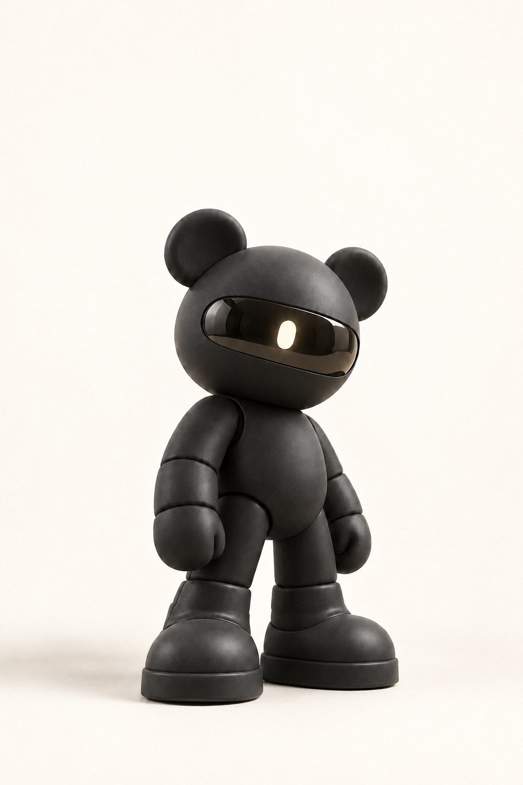 Ash, a matte graphite visor bear, stands with relaxed arms against warm ivory.